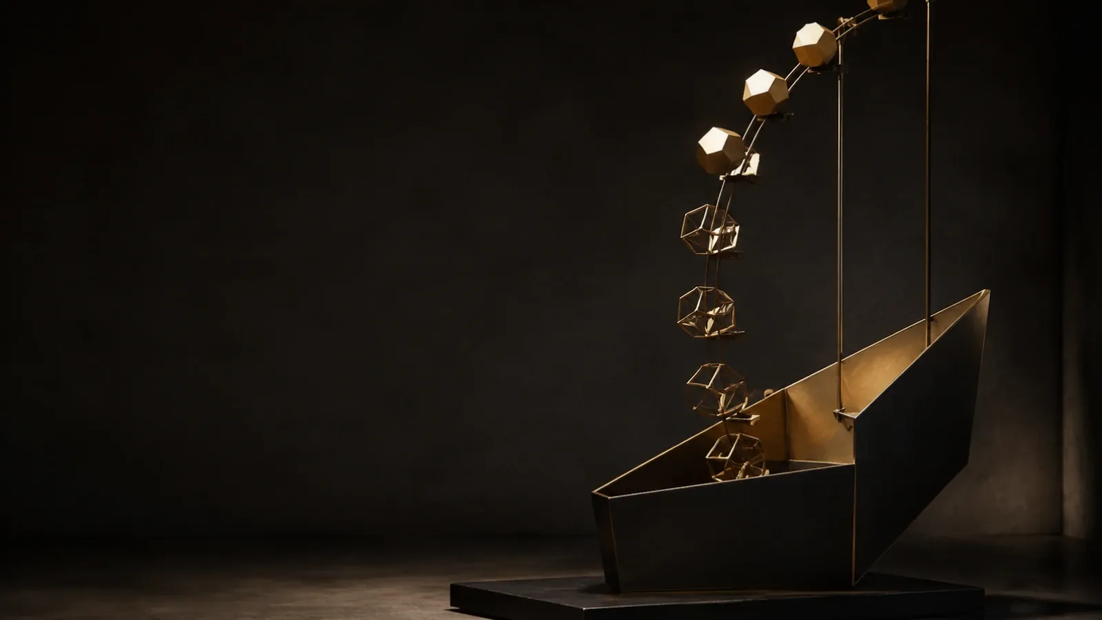 Small gold cubes rising out of an open dark box on a workbench, lit from one side.